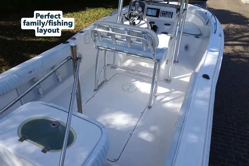 Slide: The Image of 2007 Sea Hunt Triton 232 boat with family-friendly fishing layout. - 9