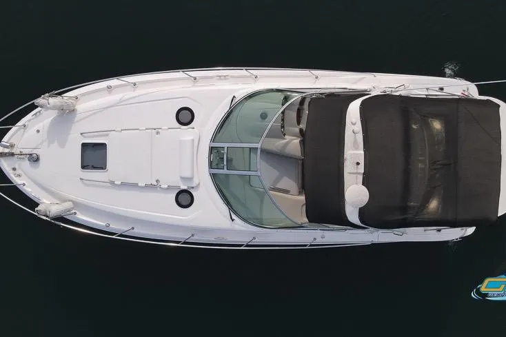 Slide: The Image of Top view of a 2007 Sea Ray Sundancer 320 boat on water. - 11
