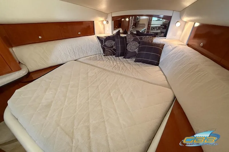 Slide: The Image of Luxurious cabin interior of 2007 Sea Ray Sundancer 320 with cozy bedding and cushions. - 16