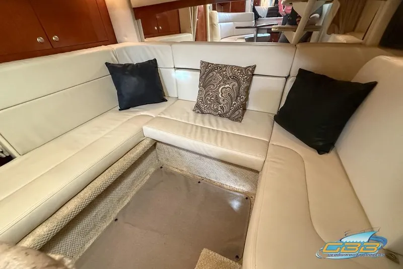 Slide: The Image of Luxurious interior of 2007 Sea Ray Sundancer 320 with plush seating and decorative pillows. - 19