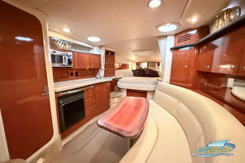 Slide: The Image of Luxurious interior of 2007 Sea Ray Sundancer 320 yacht with kitchen and seating area. - 21