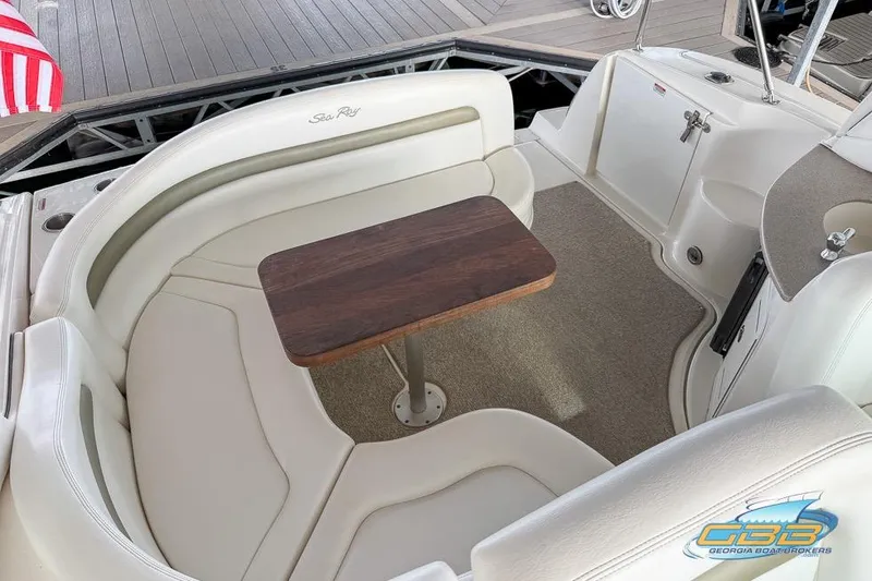 Slide: The Image of 2007 Sea Ray Sundancer 320 interior with seating and wooden table. - 31