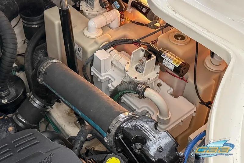 Slide: The Image of Engine compartment of a 2007 Sea Ray Sundancer 320 boat, showcasing mechanical components. - 34