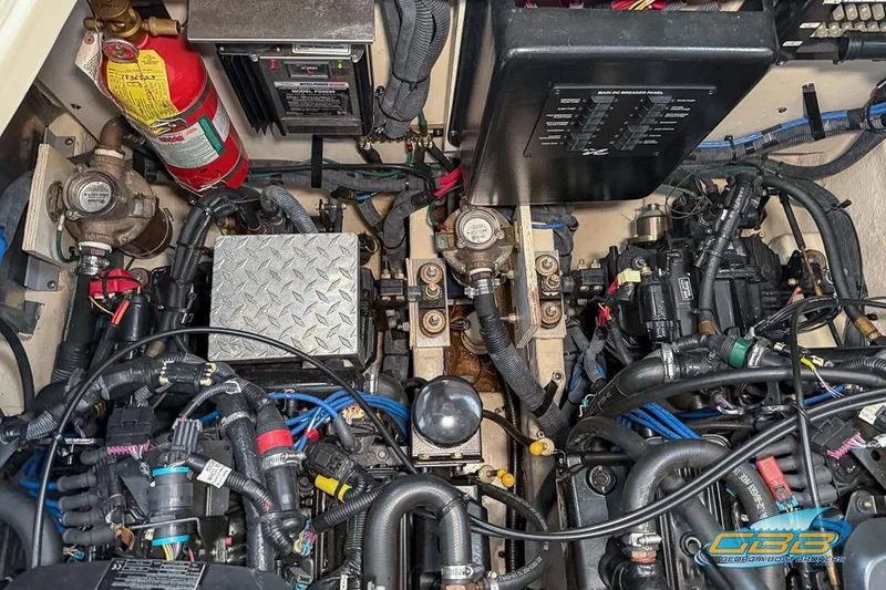 Slide: The Image of Engine compartment of a 2007 Sea Ray Sundancer 320 with wiring and components visible. - 35