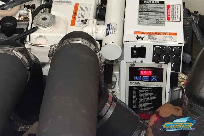 Slide: The Image of Engine compartment of a 2007 Sea Ray Sundancer 320 with Kohler generator controls. - 37