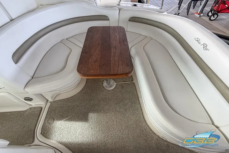 Slide: The Image of Luxurious seating area on 2007 Sea Ray Sundancer 320 with wooden table. - 38