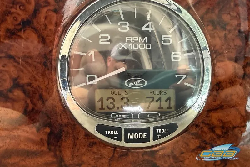 Slide: The Image of Close-up of 2007 Sea Ray Sundancer 320 RPM gauge displaying 13.3 volts and 711 hours. - 40