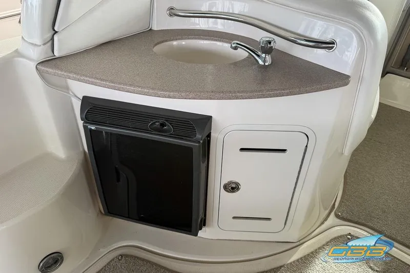 Slide: The Image of 2007 Sea Ray Sundancer 320 boat interior with sink and mini fridge. - 41