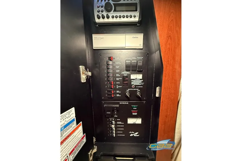 Slide: The Image of Electrical control panel of 2007 Sea Ray Sundancer 320 boat with Clarion audio system. - 42
