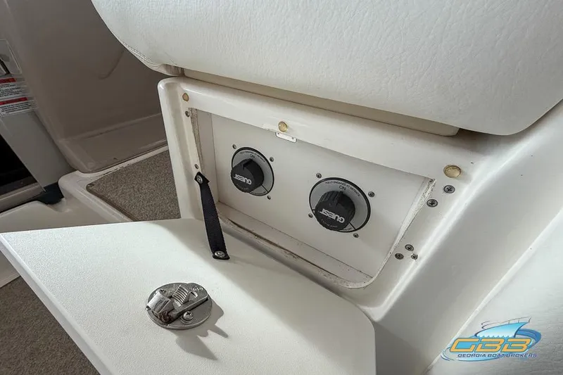 Slide: The Image of 2007 Sea Ray Sundancer 320 boat control panel with switches and latch. - 44