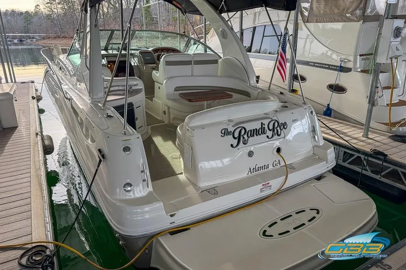 Slide: The Image of 2007 Sea Ray Sundancer 320 docked, featuring spacious seating and elegant design. - 47