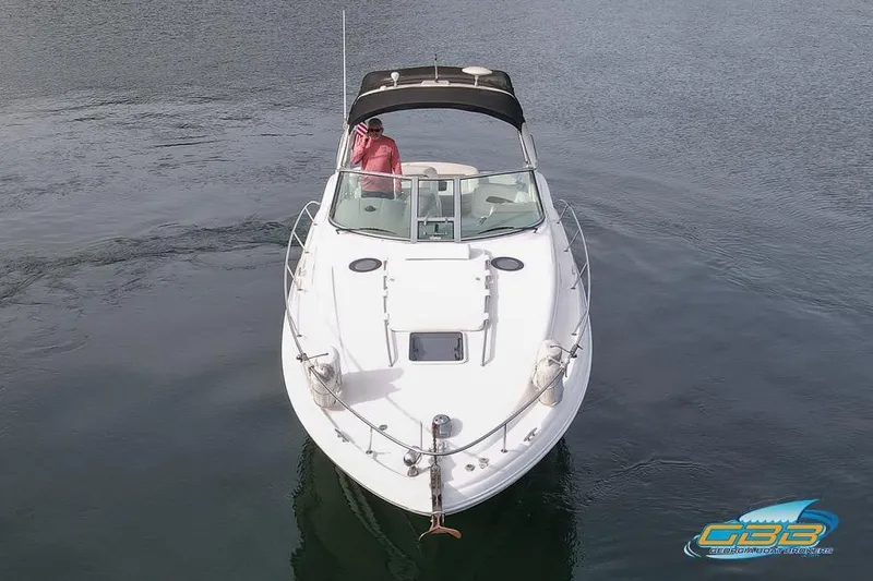 Slide: The Image of 2007 Sea Ray Sundancer 320 boat on calm water, viewed from the front. - 5