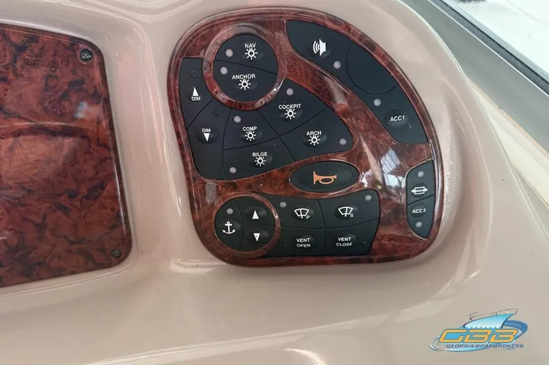 Slide: The Image of Control panel of a 2007 Sea Ray Sundancer 320 boat with various function buttons. - 51
