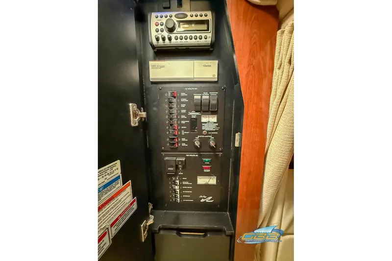 Slide: The Image of Control panel of 2007 Sea Ray Sundancer 320 boat with audio system and switches. - 53