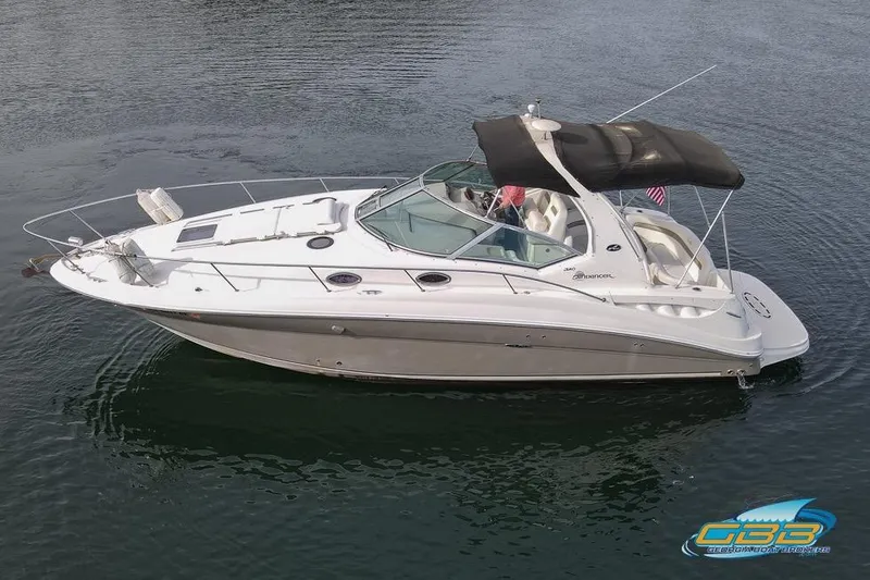 Slide: The Image of 2007 Sea Ray Sundancer 320 boat on calm water, featuring sleek design and spacious deck. - 8
