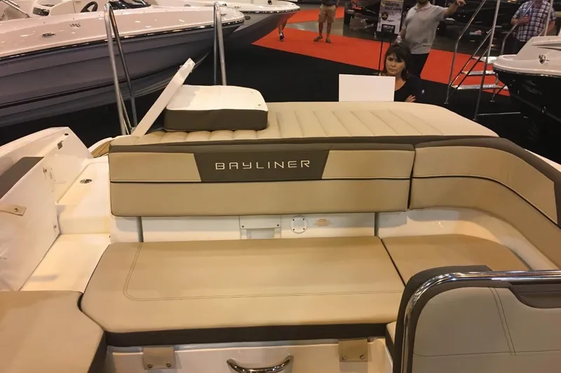 Slide: The Image of 2017 Bayliner VR6 Bowrider I/O with beige seating at a boat show. - 21