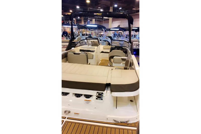 Slide: The Image of 2017 Bayliner VR6 Bowrider I/O with beige seating, showcased indoors. - 23