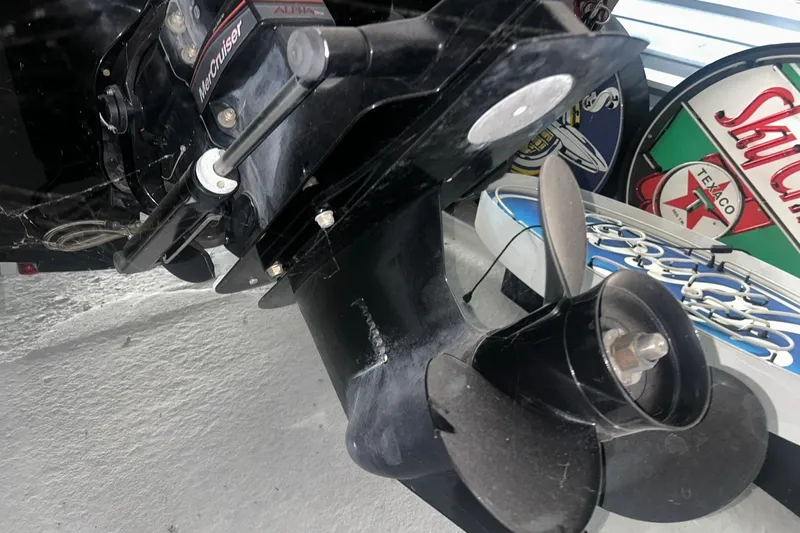 Slide: The Image of Close-up of 2017 Bayliner VR6 Bowrider I/O boat propeller and engine. - 28