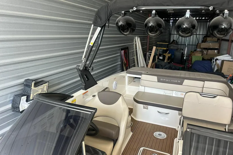 Slide: The Image of 2017 Bayliner VR6 Bowrider I/O in storage, featuring seating and equipment. - 3
