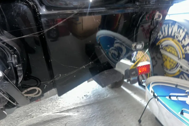 Slide: The Image of 2017 Bayliner VR6 Bowrider I/O boat rear view in a garage setting. - 40