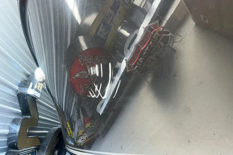 Slide: The Image of 2017 Bayliner VR6 Bowrider I/O boat hull with reflections in a storage area. - 43