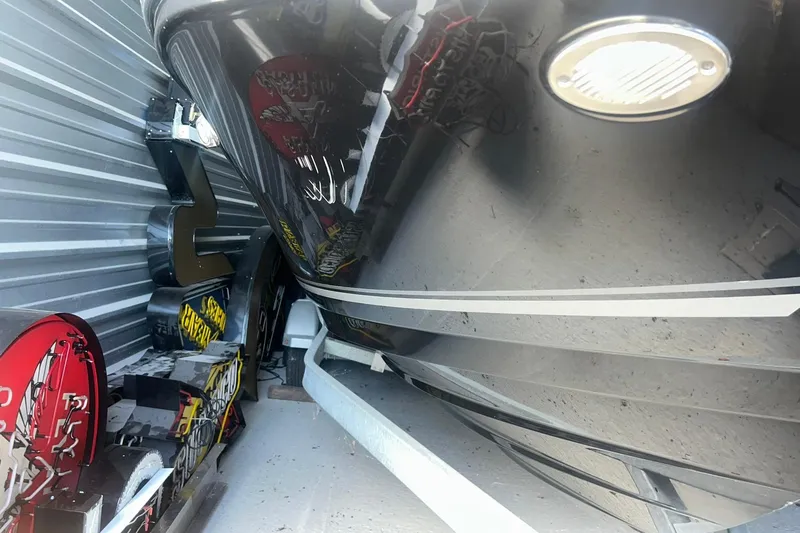 Slide: The Image of 2017 Bayliner VR6 Bowrider I/O stored in a metal facility with signage nearby. - 45