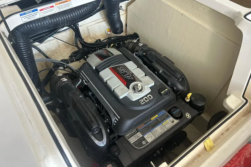 Slide: The Image of 2017 Bayliner VR6 Bowrider I/O engine compartment with Mercury 4.5L 200 HP engine. - 47