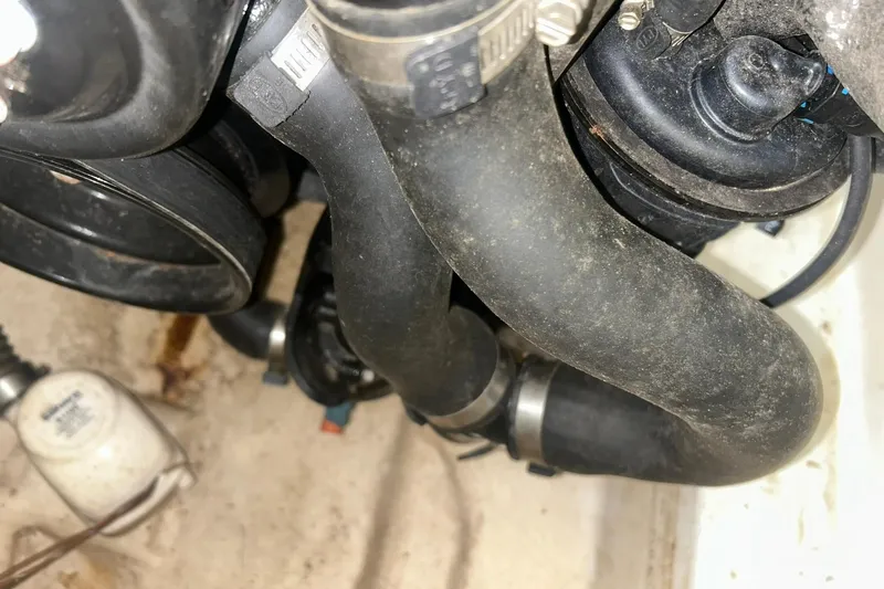 Slide: The Image of Engine compartment of a 2017 Bayliner VR6 Bowrider I/O with visible hoses and clamps. - 53