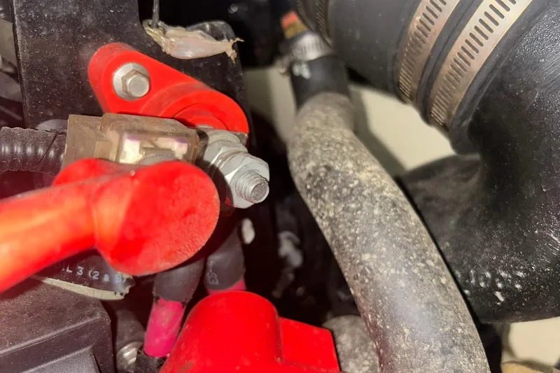 Slide: The Image of Close-up of 2017 Bayliner VR6 Bowrider I/O engine components with red connectors and hoses. - 57