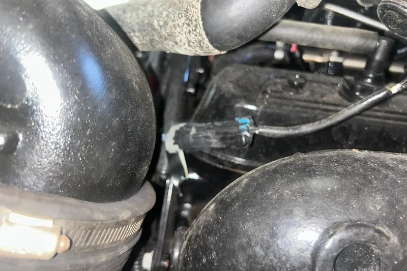 Slide: The Image of Close-up of 2017 Bayliner VR6 Bowrider I/O engine components and wiring. - 59