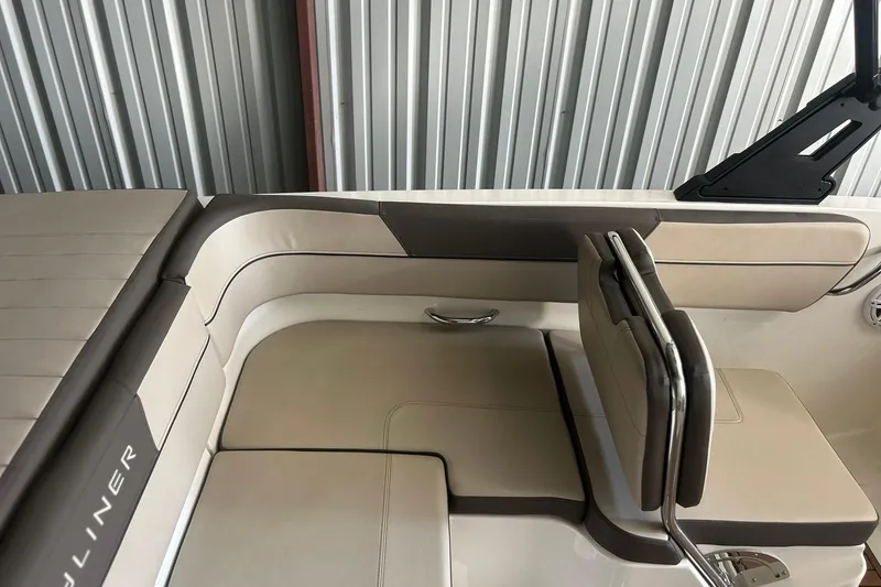 Slide: The Image of 2017 Bayliner VR6 Bowrider I/O interior with beige seating and sleek design. - 7