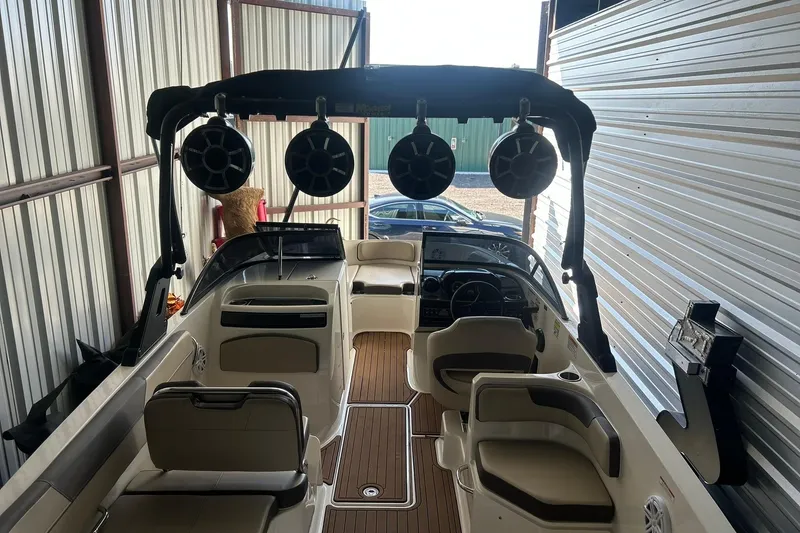 Slide: The Image of 2017 Bayliner VR6 Bowrider I/O in storage, featuring spacious seating and modern design. - 8
