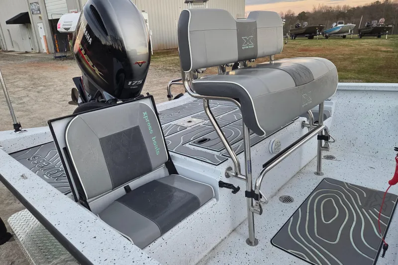 Slide: The Image of 2023 Xpress H22B Bay boat interior with Yamaha 175 engine, featuring gray seating and deck. - 12