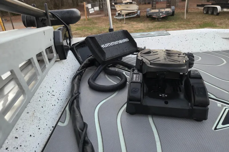 Slide: The Image of 2023 Xpress H22B Bay boat with Humminbird fishfinder and trolling motor on deck. - 15