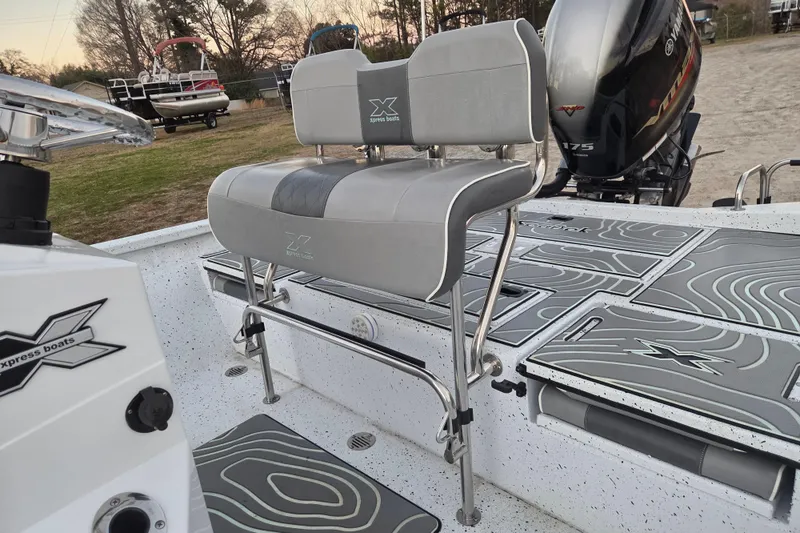 Slide: The Image of 2023 Xpress H22B Bay boat interior with seating and Yamaha 175 engine. - 17