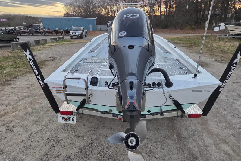 Slide: The Image of 2023 Xpress H22B Bay boat with 175 HP engine, parked outdoors. - 5
