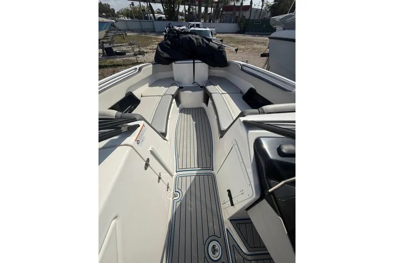 Slide: The Image of 2023 Yamaha Boats AR250 interior with spacious seating and sleek design. - 5