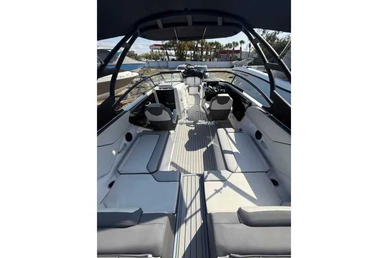 Slide: The Image of 2023 Yamaha Boats AR250 interior with sleek seating and modern design. - 8
