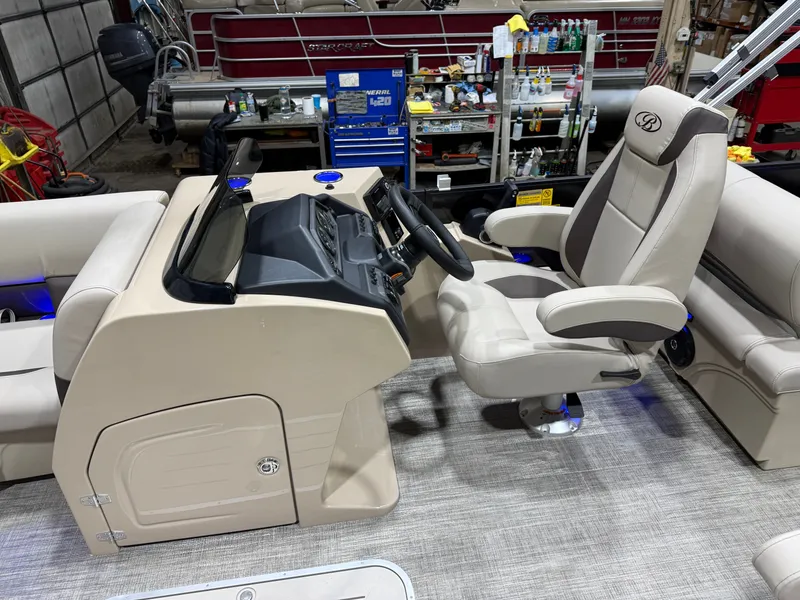 Slide: The Image of Interior of 2026 Bentley Pontoons Legacy with helm console and seating. - 11