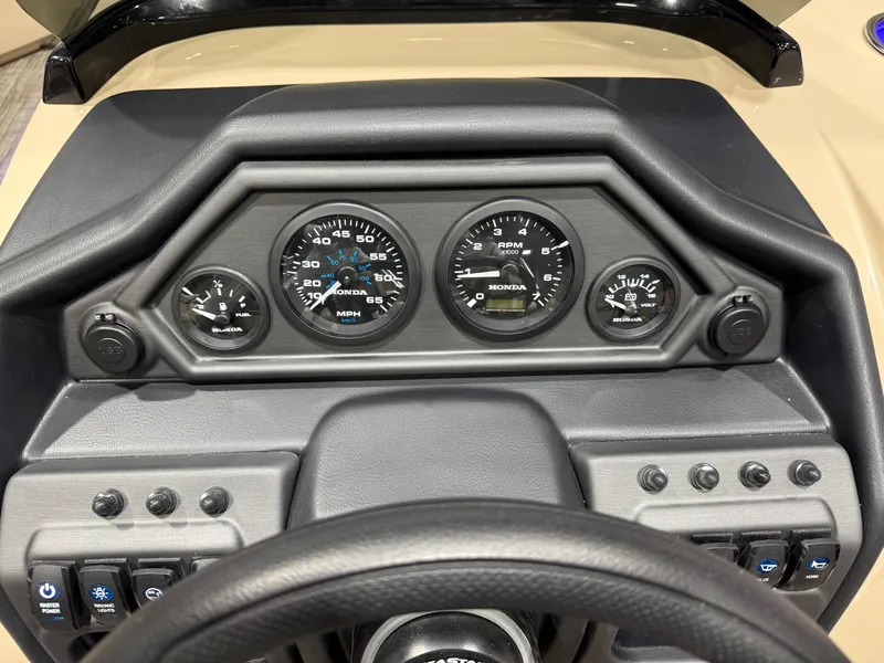 Slide: The Image of Dashboard of 2026 Bentley Pontoons Legacy with gauges. - 14