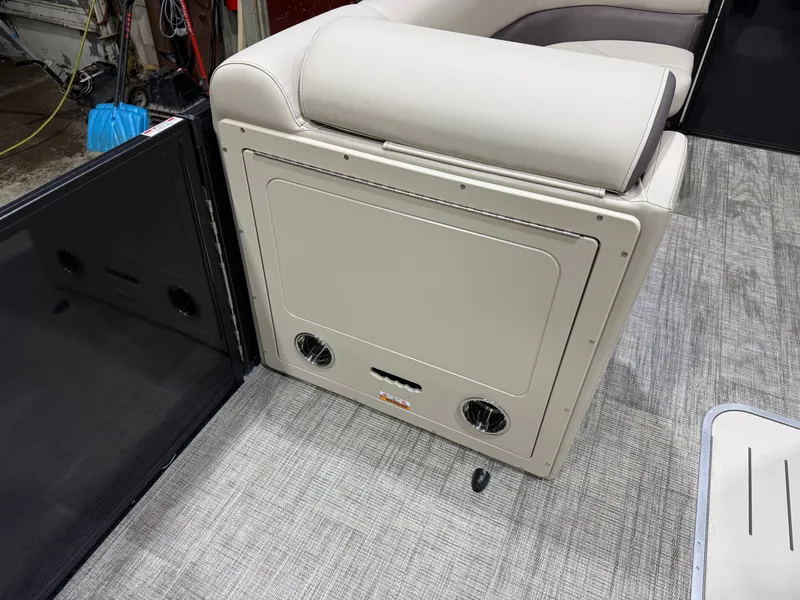 Slide: The Image of Interior of 2026 Bentley Pontoons Legacy with gray carpet flooring. - 26