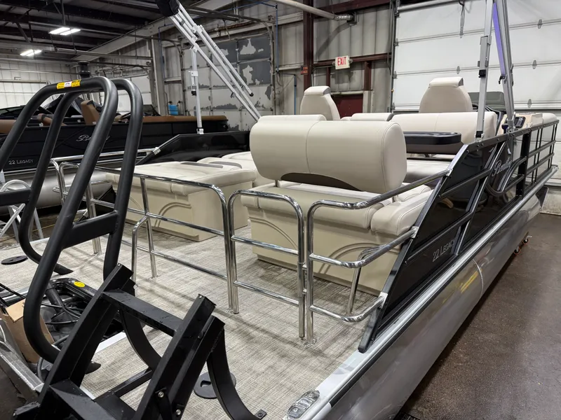 Slide: The Image of 2026 Bentley Pontoons Legacy Tritoon displayed indoors. - 45