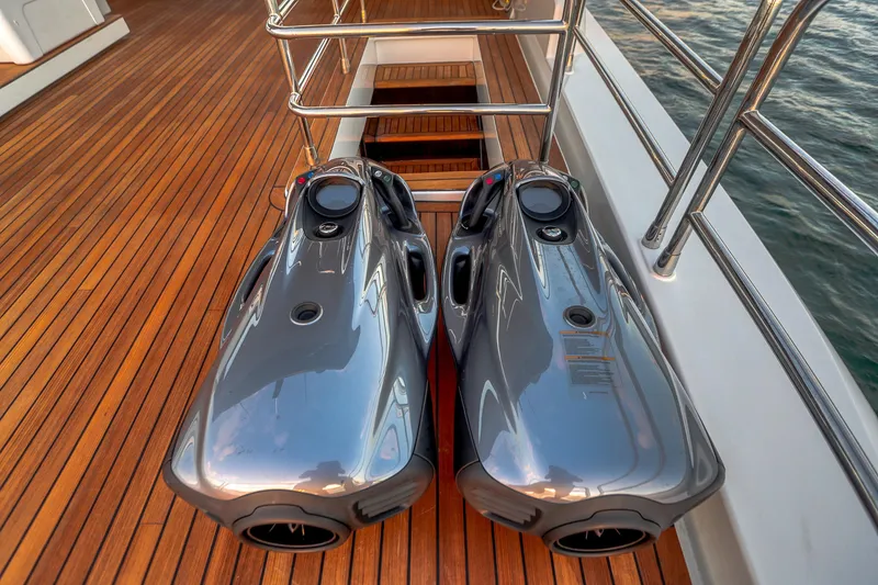 Slide: The Image of Two sleek underwater scooters on the deck of a 2021 Sirena 88 yacht. - 10