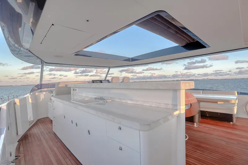 Slide: The Image of Luxurious 2021 Sirena 88 yacht deck with modern bar and ocean view. - 17
