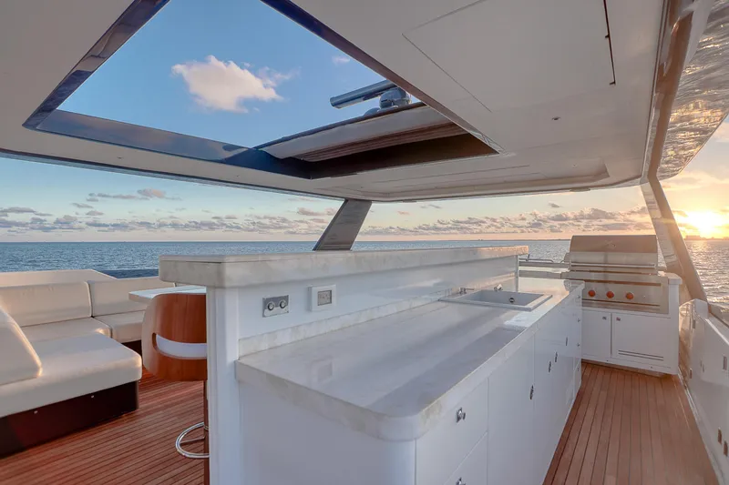Slide: The Image of Luxurious 2021 Sirena 88 yacht deck with sunset ocean view and modern amenities. - 19