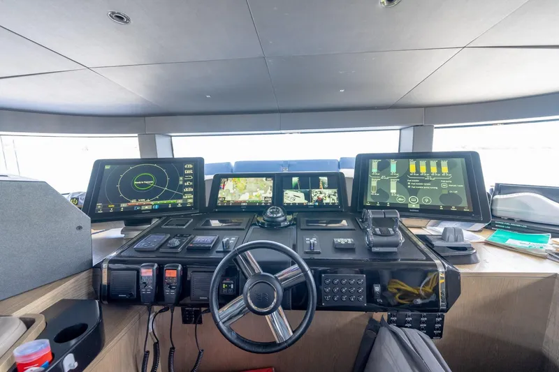 Slide: The Image of Modern helm station of 2021 Sirena 88 yacht with advanced navigation displays and controls. - 23