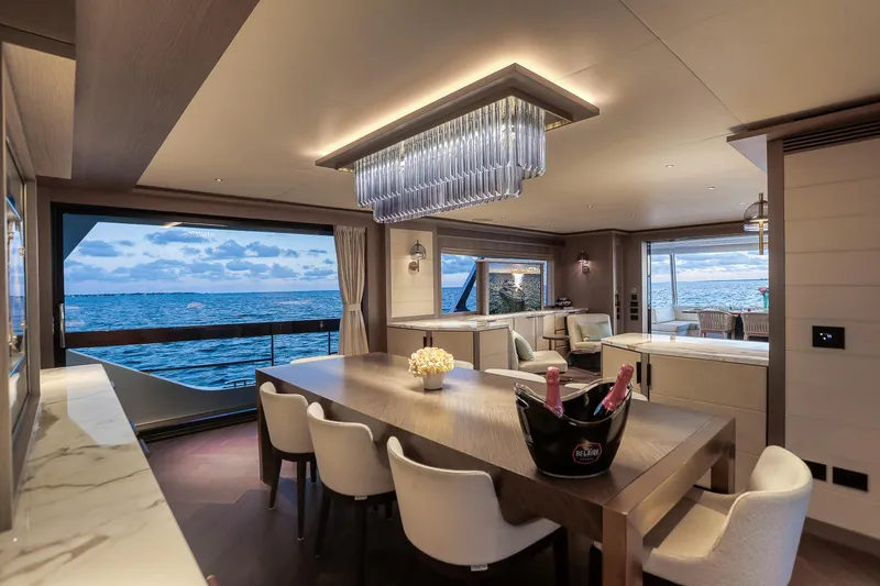 Slide: The Image of Luxurious interior of 2021 Sirena 88 yacht with ocean view and elegant dining area. - 29