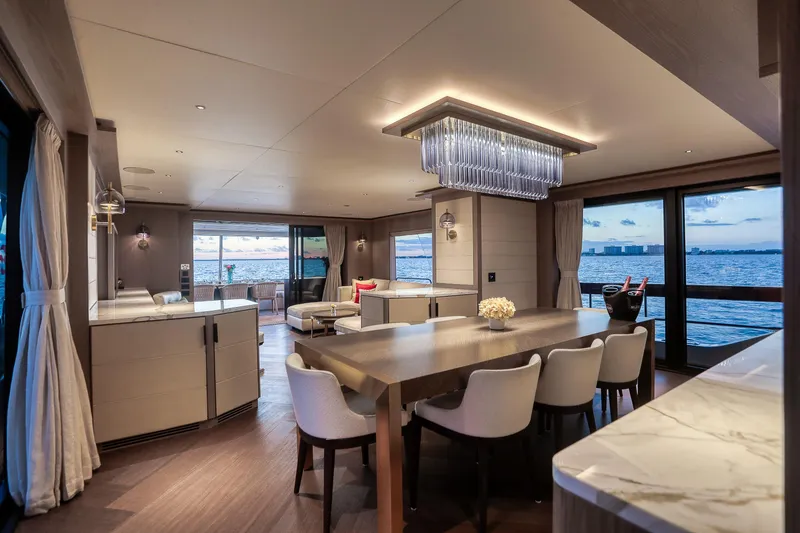 Slide: The Image of Luxurious interior of 2021 Sirena 88 yacht with elegant dining area and ocean view. - 30