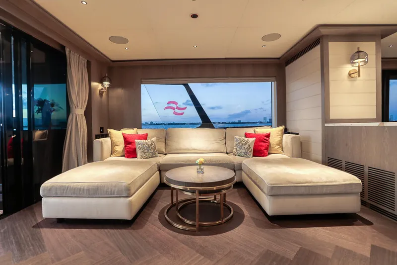 Slide: The Image of Luxurious interior of 2021 Sirena 88 yacht with elegant beige sofa and sea view. - 34
