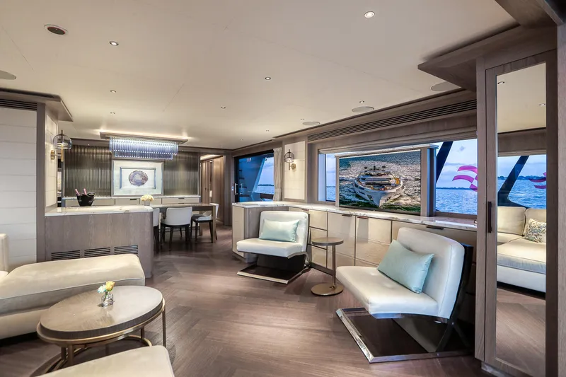 Slide: The Image of Luxurious interior of 2021 Sirena 88 yacht with elegant seating and large windows. - 36